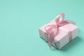 Beautiful gift box on color background