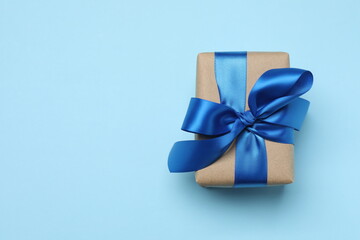 Beautiful gift box on color background