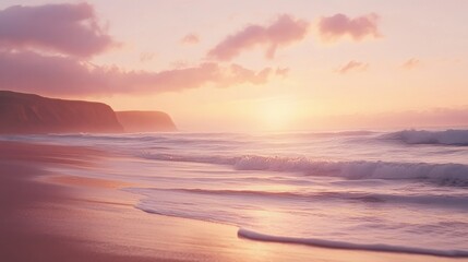 Obraz premium Beautiful sunrise paints the ocean with soft hues over sandy shores