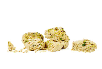 Sesame halva with pistachios isolated on white background