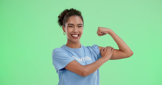 Volunteer, woman and happy in green screen with biceps for love, support and care. Portrait, studio and smile or exited with confident on community service or charity for change, trust and NGO