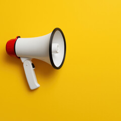 megaphone on a yellow background with copy space