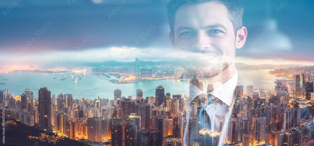 Poster Double exposure image of a smiling man superimposed over a Hong Kong cityscape at twilight. Urban skyline blends with a confident person.