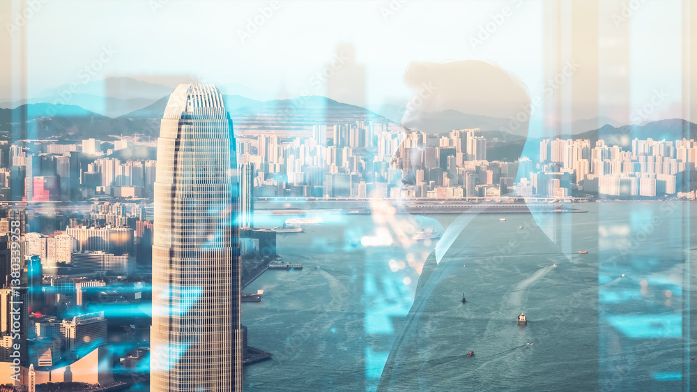Poster A double exposure blends a person in a suit with a cityscape view of Hong Kong.  Urban architecture and harbor scene are visible through the silhouette.
