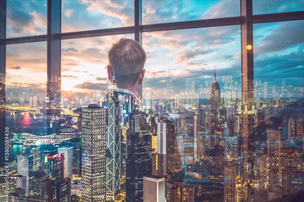 Poster A man observes the Hong Kong cityscape through a window, creating a double exposure effect. City lights and buildings blend with the interior scene in a modern setting.