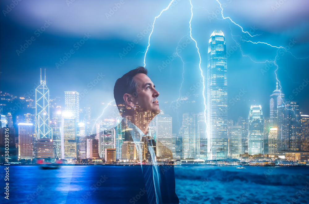 Poster double exposure image features a man looking upwards, overlaid with a vibrant hong kong cityscape at