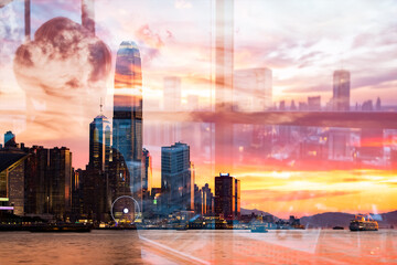 Obraz premium Hong Kong skyline at sunset using double exposure technique, blending cityscapes with a warm, vibrant sky.