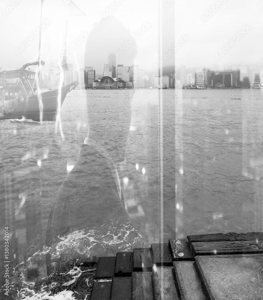 Aufkleber Monochromatic double exposure of Hong Kong cityscape blending with a silhouette. Water and wooden planks in the foreground create depth and texture in the urban scene.