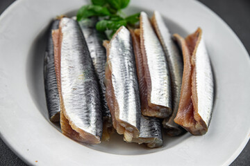 Sardines fish salted gourmet food background on the table rustic food top view copy space