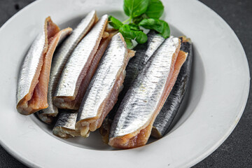 Sardines fish salted gourmet food background on the table rustic food top view copy space