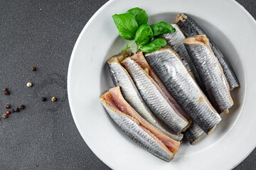 Sardines fish salted gourmet food background on the table rustic food top view copy space