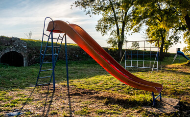 Fototapeta premium Children playground with swings and slides park