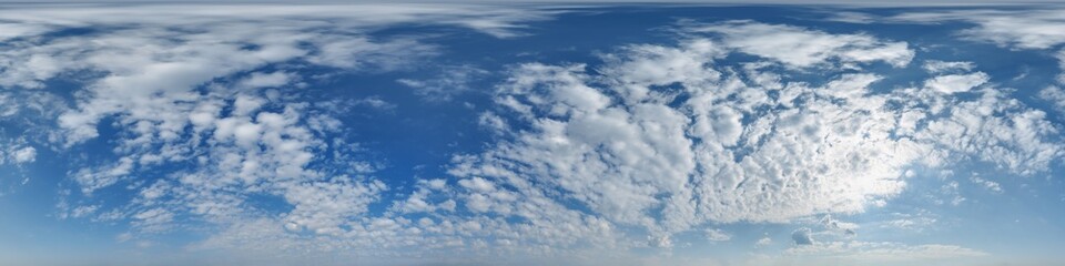 blue sky hdri 360 panorama with clouds and sun before sunset with zenith for use in 3d graphics as sky dome or edit drone shot as sky replacement
