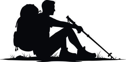 Obraz premium Silhouette of a resting hiker sitting on the ground with a backpack and trekking pole