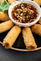 Nem rolls  sauce vietnamese rice paper roll gourmet food background on the table rustic food top view copy space