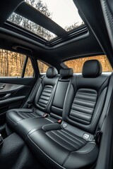 Fototapeta premium Luxurious leather interior of a modern car showcases elegance in a serene forest setting during early morning light