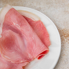 Ham slices pork meat tasty gourmet food background on the table rustic food top view copy space