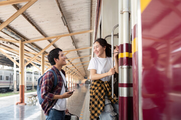 Connection and Journey. A couple preparing to board the train, filled with excitement for their travels.