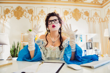 Elegant woman aristocrat in a vintage style office with modern elements emphasizing the blend of...