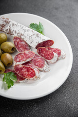 Fuet sausage meat Spanish delicacy gourmet food background on the table rustic food top view copy space