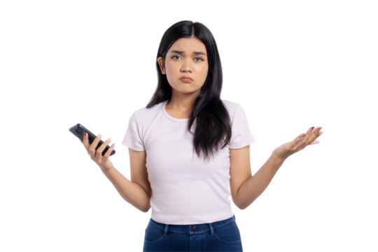 Confused young Asian woman holding smartphone, shrugging with uncertain expression, experiencing mobile problem or network issue, isolated on transparent background