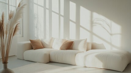 Fototapeta premium Minimalist living room with a white sectional sofa adorned with contrasting orange and neutral-toned pillows