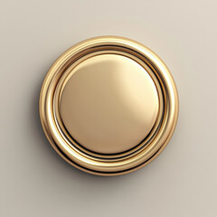 Shiny, round gold button with a decorative rim on a smooth surface.