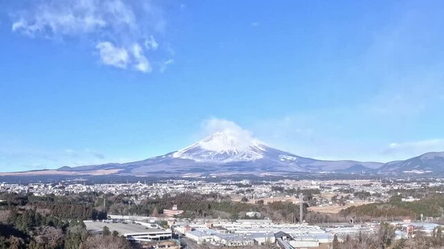 Mount Fuji time lapse daytime clouds forming and traffic driving by on highway