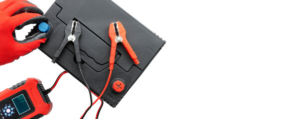 Positive terminal and negative terminal of booster cables with car battery charging on AGM battery. Concept of battery or car recovery with error. Top view, with copy space, isolated background.