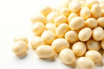 Fototapeta premium Close-up of creamy white beans against stark white, ingredient, vegetarian, raw