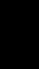 Freeze motion of dust particles flying , isolated on black background