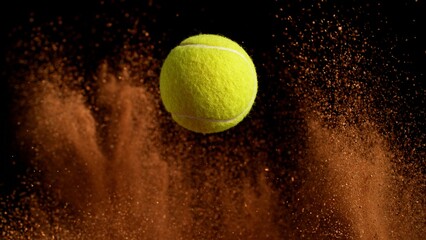 Freeze Motion Detail Shot of Flying Tennis Ball with Clay Explosion © Lukas Gojda
