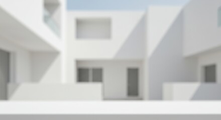 Abstract blurred view of a modern white building complex on a sunny day with blue sky above
