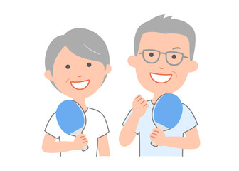 Fototapeta premium 卓球のラケットを手に,笑顔のシニア男女