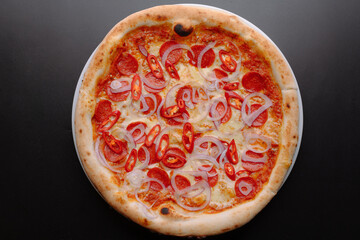 Delicious Pepperoni Pizza with Spicy Peppers and Onions