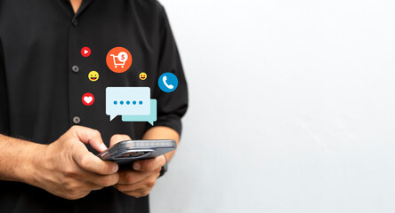 man using smartphone with social media icons for online chat and shopping