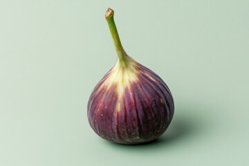Obraz premium Unique fig with smooth skin and vibrant colors on soft pastel ba
