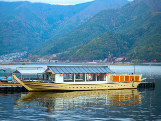 Lake Kawaguchiko in Japan. Traditional boat for trip to Fuji. Vintage sea ferry. Boat in lake...