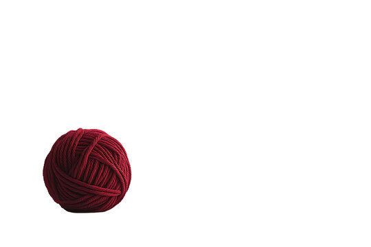 Crimson Yarn Ball on White Background: Minimalist Craft Texture