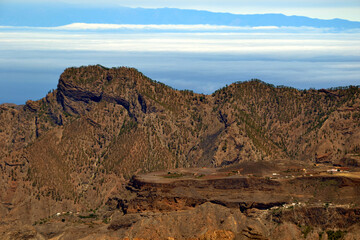 Scenic mountainous areas in the central part of Gran Canaria, Canary Islands, Spain. Tenerife island seen in the distance