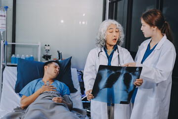 Obraz premium Nurse giving assistance to senior patient with disease in bed. Medical assistant and doctor doing healthcare checkup for pensioner with oxygen tube and IV drip bag in hospital ward.