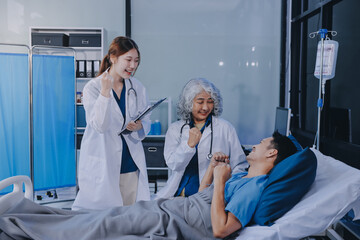 Nurse giving assistance to senior patient with disease in bed. Medical assistant and doctor doing...