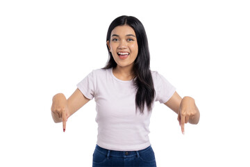Happy young Asian woman pointing down with both hands, isolated on transparent background