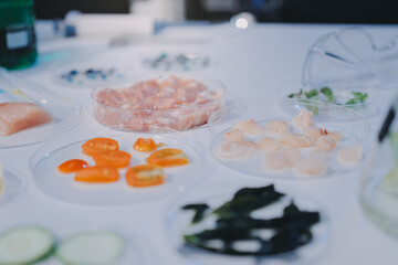 Team Asian scientists in a lab conducting food research using a microscope and lab equipment,...
