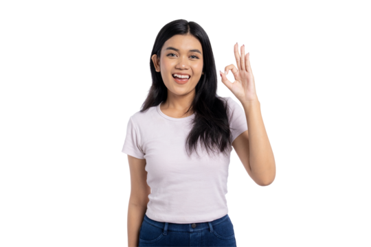 Happy young Asian woman showing OK hand gesture, smiling and expressing positivity, isolated on transparent background