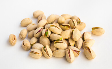 Roasted pistachios on white background