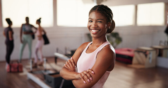 Woman, arms crossed and smile at gym in portrait, pride and confidence for exercise, fitness and health. Girl, happy and break with training, workout and confident for transformation at wellness club