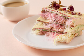 Tasty trendy breakfast with handicraft coffee and pink chocolate with airy filling white and pink pismaniye. Dessert with Cotton candy Close up.