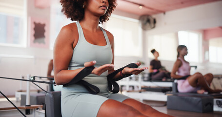 Fitness, pilates and reformer with hands of woman in class for improvement, training or workout...