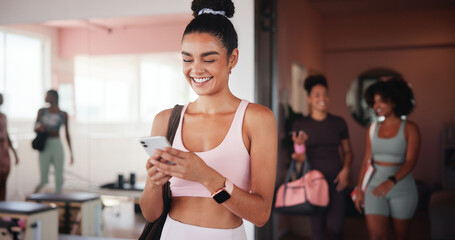 Woman, smartphone and texting at gym with fitness, contact or excited with smile for stats at club. Girl, phone and mobile app for progress, report and happy for results with chat at exercise class